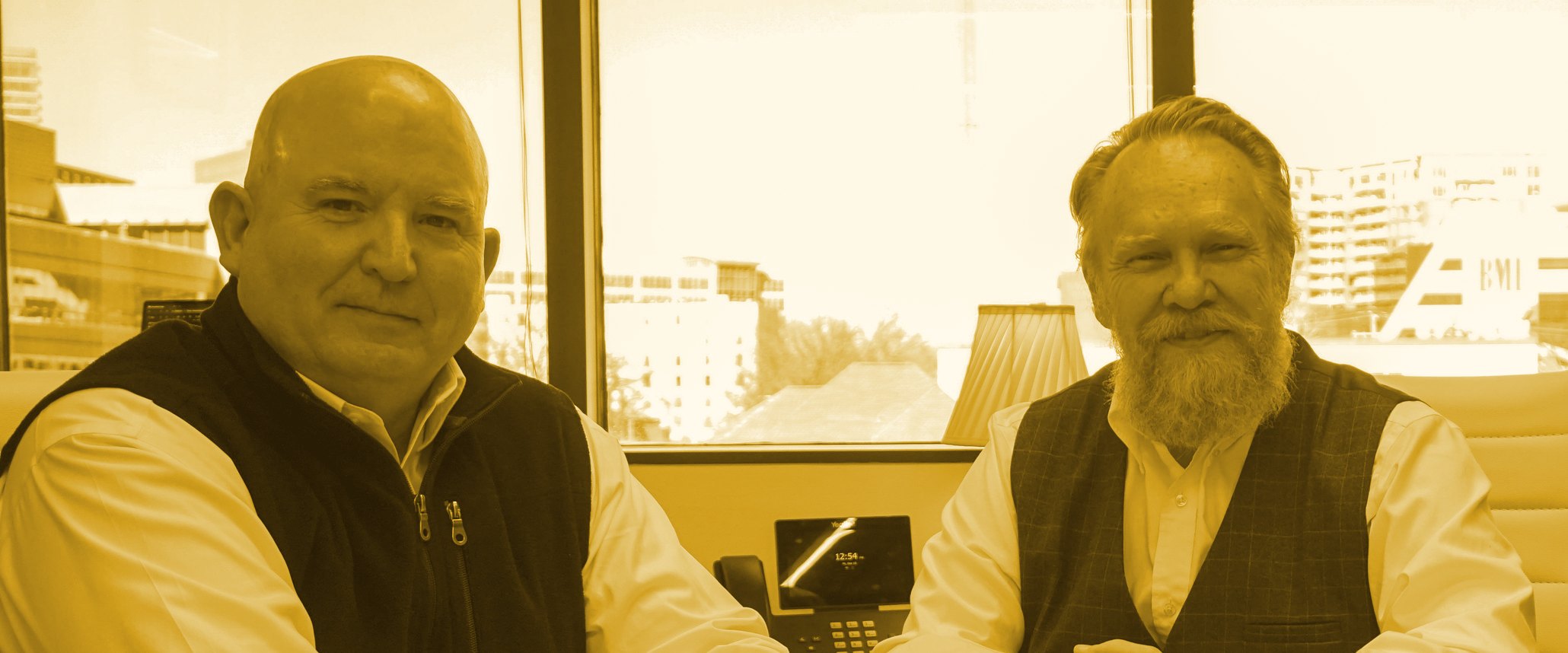 schedule-consult-gold Barry Neil Shrum and Dennis Disney of Shrum Disney & Associates in the firm conference room